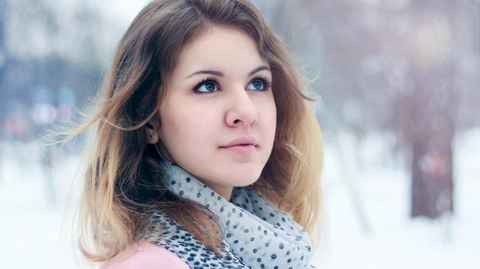 Woman with brown eyes and scarf in winter