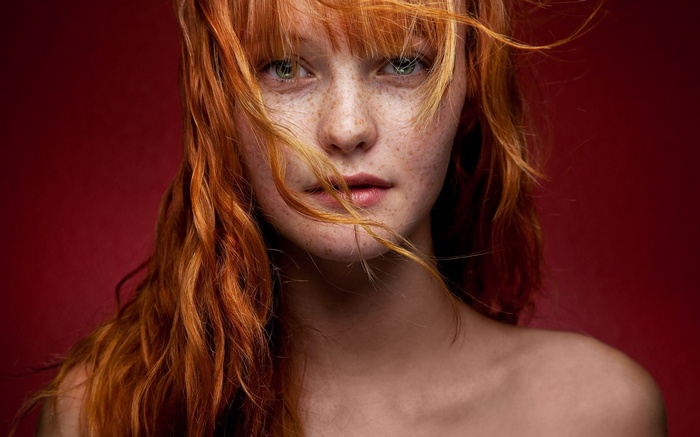 Redhead woman with freckles and green eyes