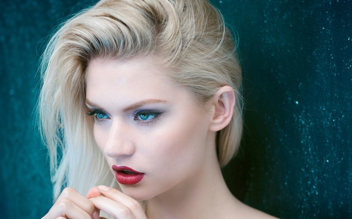 Martina Dimitrova with blonde hair and red lipstick