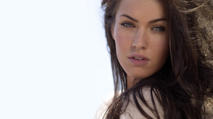 Megan Fox with dark hair and blue eyes
