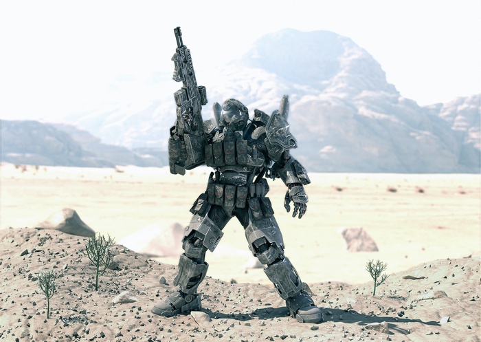 Soldier in sci-fi armor holding a rifle in a desert
