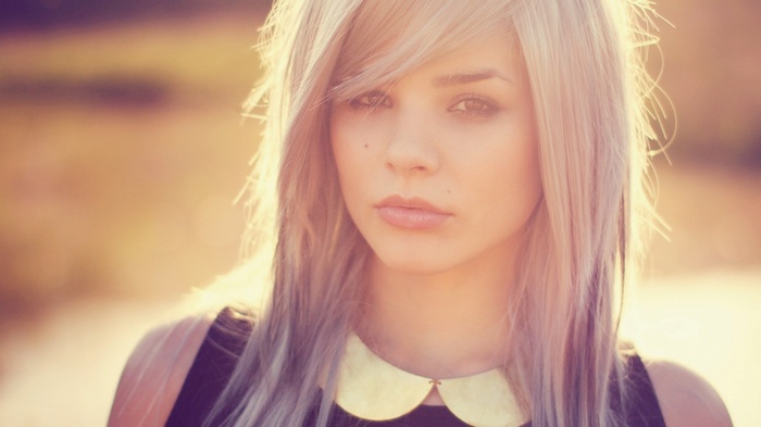 Julia Coldfront portrait with blonde hair and collar