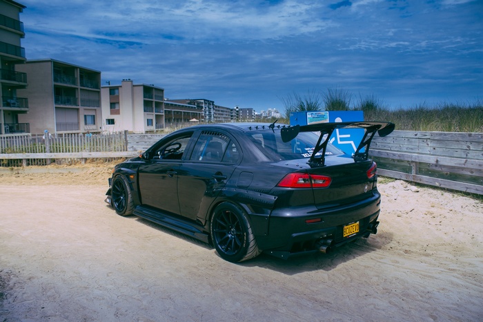 Black Mitsubishi Lancer Evo X with large spoiler