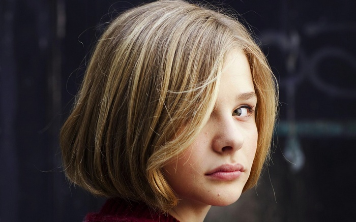 Chloë Grace Moretz looking over her shoulder