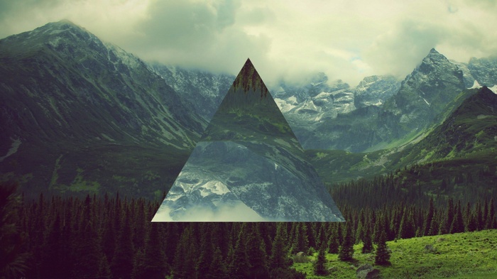 Triangle overlay on mountain landscape with forest