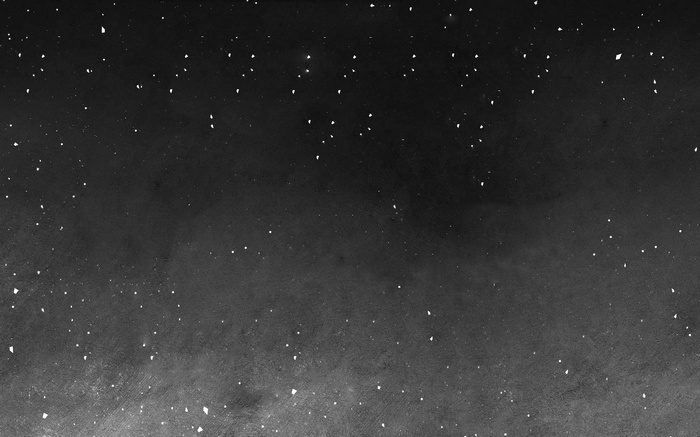 Dark background with white speckles