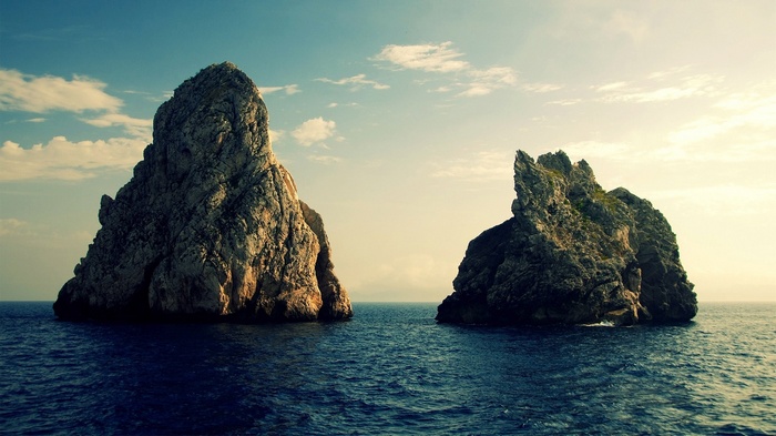 Two large rock formations in the ocean