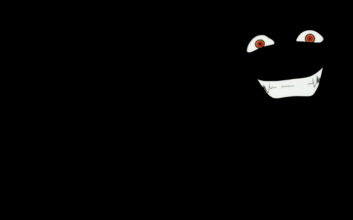 Creepy smiling face with red eyes on black background