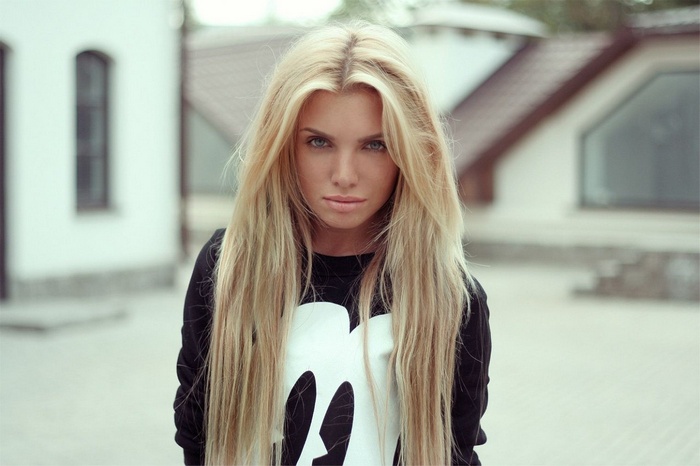 Woman with long blonde hair outdoors