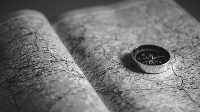 Compass on an open map