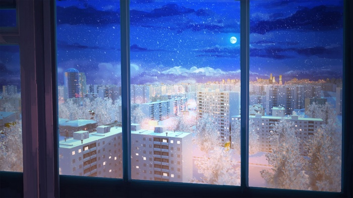 Snowy night cityscape viewed through a window