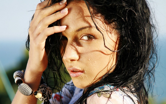 Katie Fey with wet hair and bracelet
