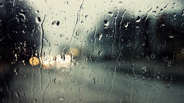 Water drops on glass with bokeh lights