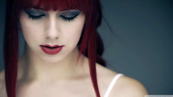 Woman with red hair and makeup