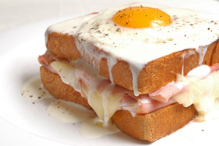 Croque Madame sandwich with fried egg and cheese