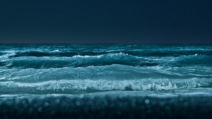 Dark blue sea with waves at night