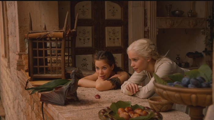 Daenerys Targaryen and Irri with a baby dragon