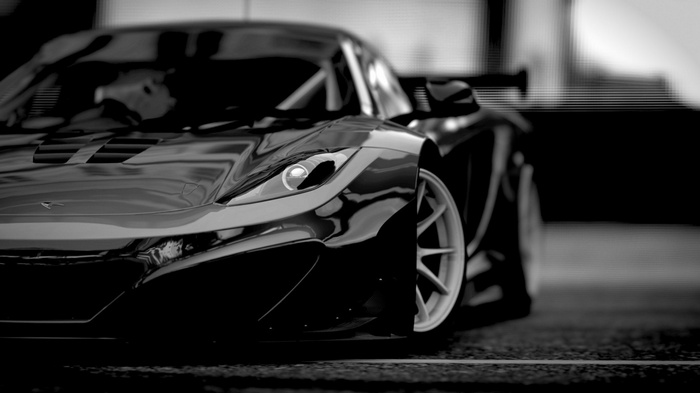 Black McLaren P1 sports car on a road