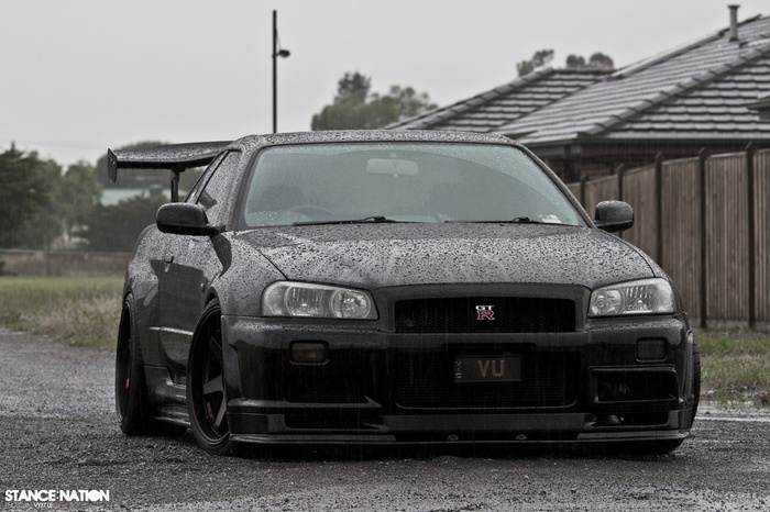 Black Nissan Skyline GT-R R34 in the rain
