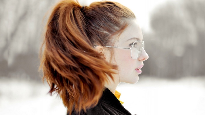 Ebba Zingmark in profile with glasses and red hair