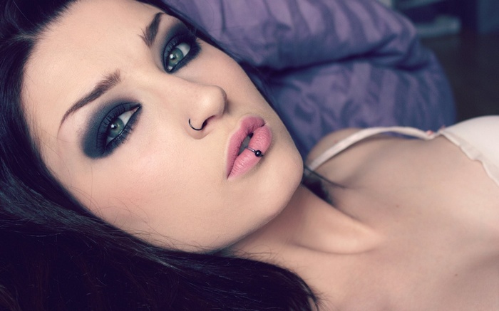Lolina Green with smoky eyes and piercings