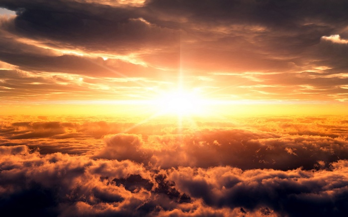 Sunlight shining through clouds at sunset