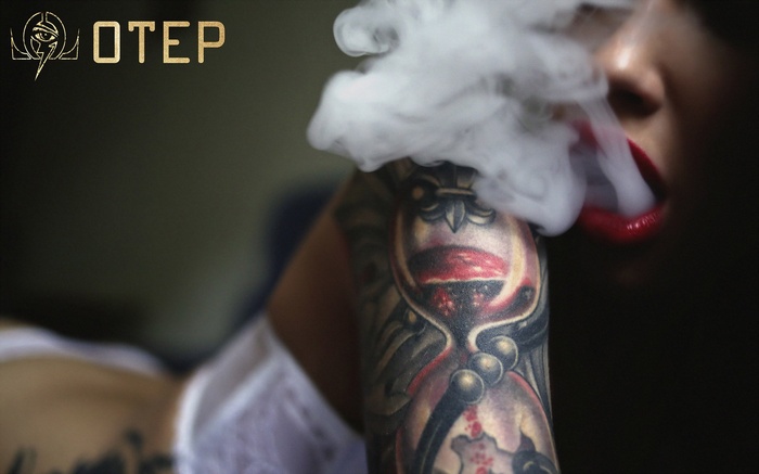 Otep logo with a woman smoking