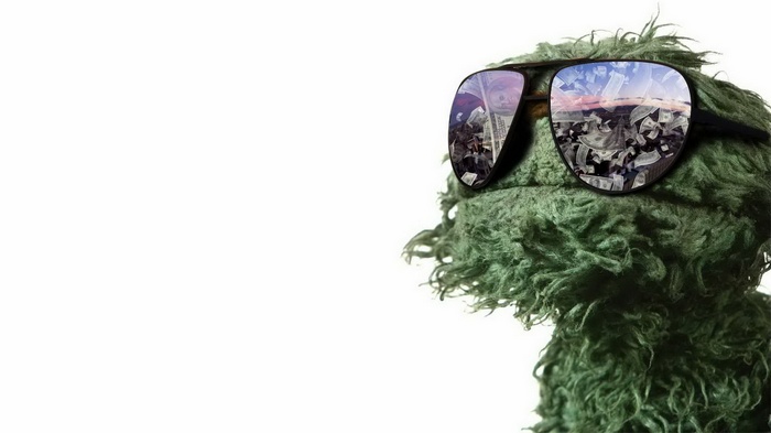 Oscar the Grouch wearing sunglasses reflecting money