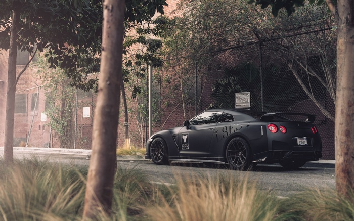 Matte black Nissan GT-R R35 parked on a street