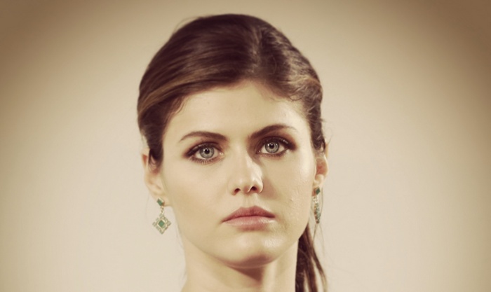 Alexandra Daddario portrait with blue eyes and earrings