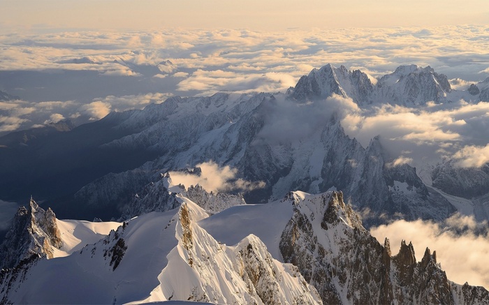 Mont Blanc mountains covered in snow with clouds