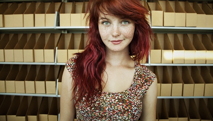Redhead woman with freckles and green eyes