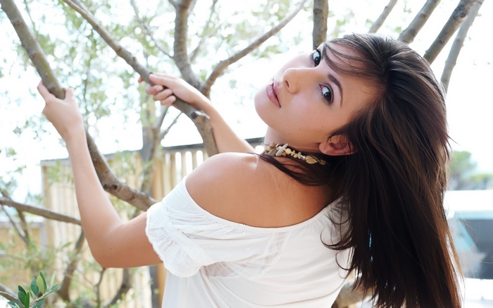 Conny Lior posing among trees