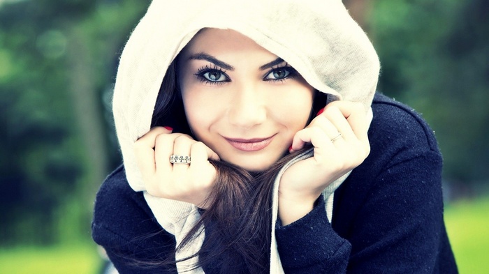 Woman wearing a hooded jacket outdoors