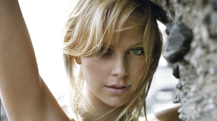 Charlize Theron portrait with rock formation