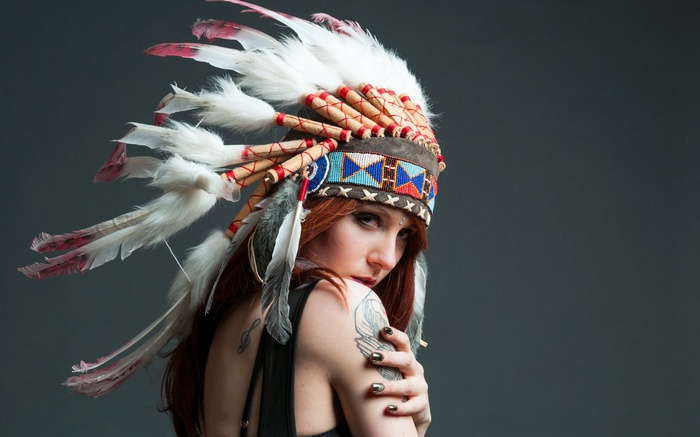 Woman with Native American Headdress and Tattoos
