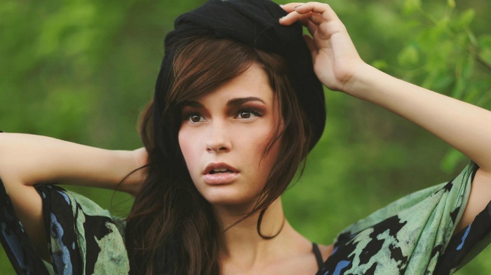 Casey Carlson with black headscarf and patterned dress