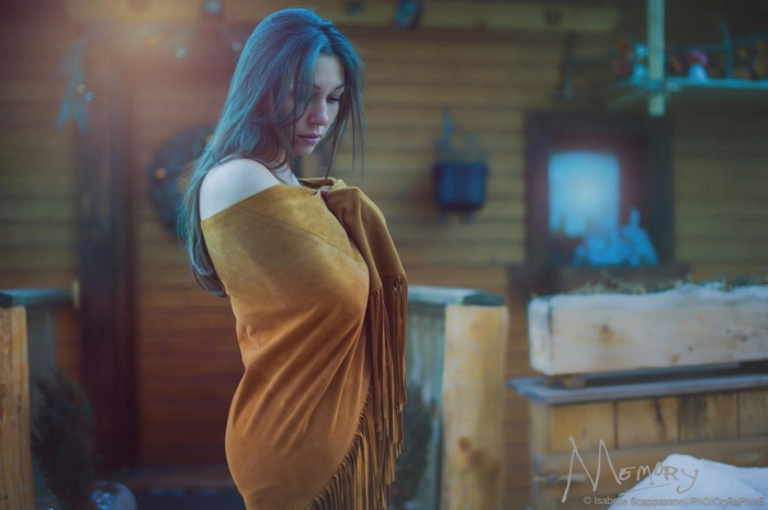 Woman with long hair wrapped in a shawl