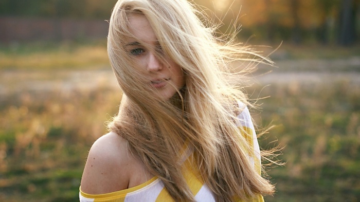 Blonde woman with long hair outdoors