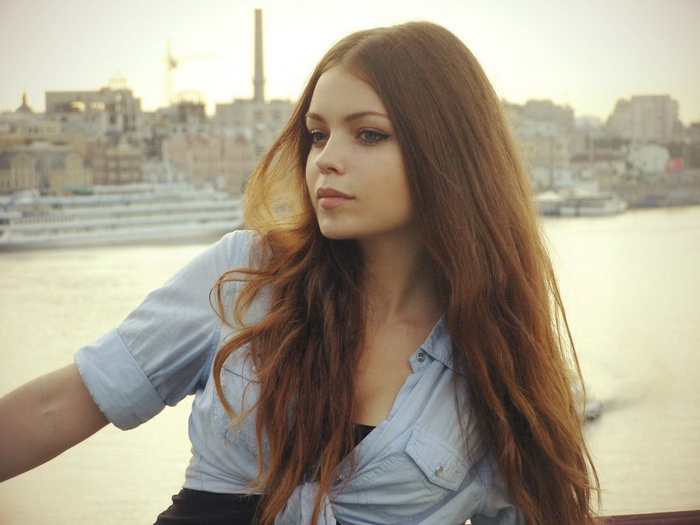 Woman with long brown hair outdoors