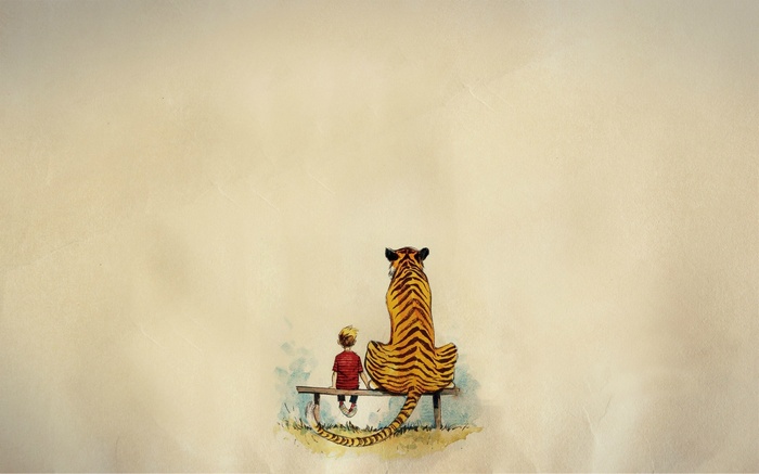 Calvin and Hobbes sitting on a bench