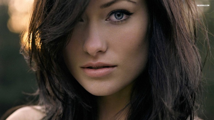 Olivia Wilde with long dark hair and blue eyes