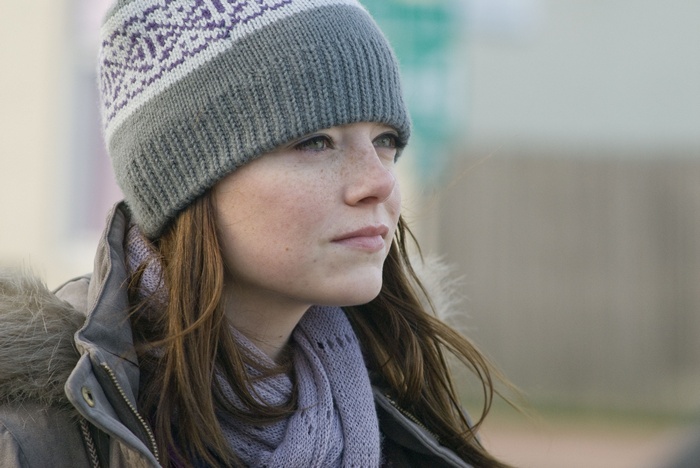 Emma Stone wearing a hat and scarf