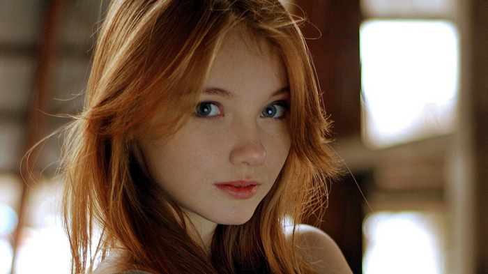 Olesya Kharitonova, a redhead model with blue eyes