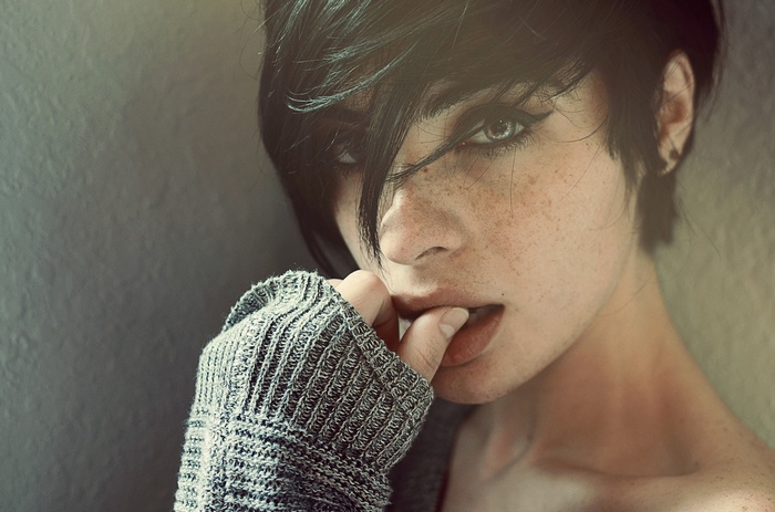 Segovia Amil portrait with freckles and finger in mouth