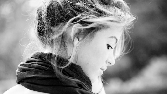 Monochrome profile of a woman with windblown hair