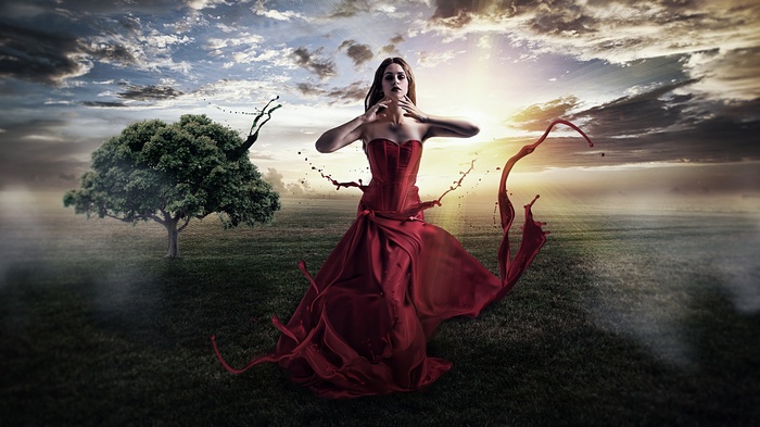 Fantasy girl in red dress with splashing paint