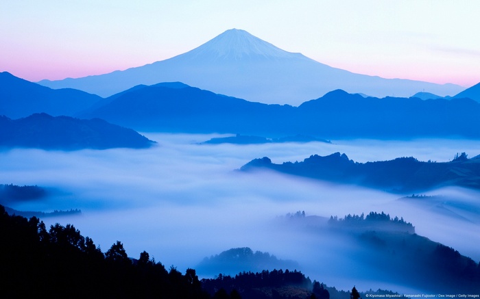 Mount Fuji and mist over mountains in Japan