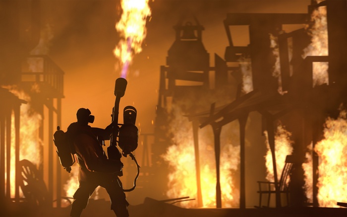 Pyro from Team Fortress 2 with a flamethrower in a burning town