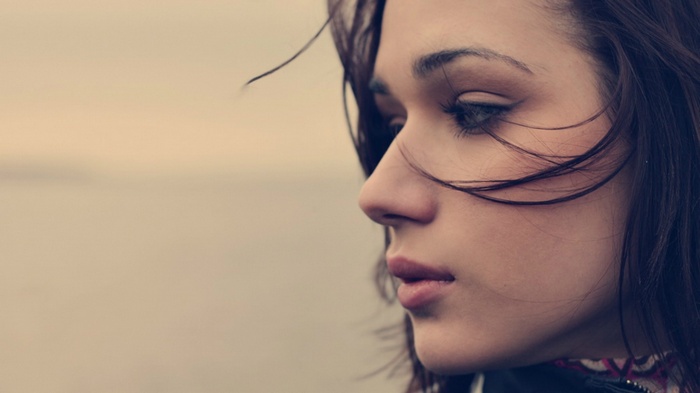 Woman in profile with windblown hair